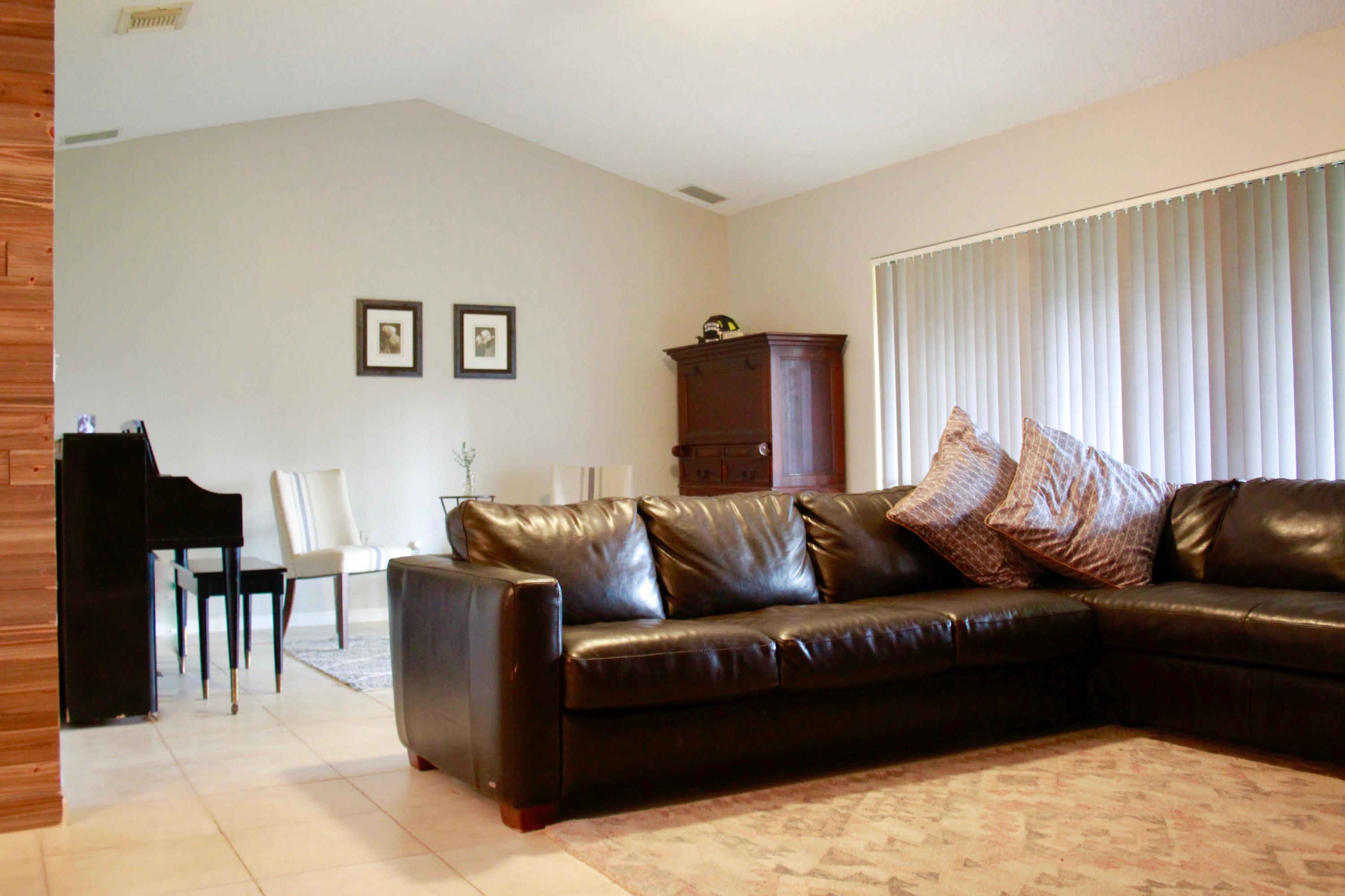 8986 Southwest 19th Street, Unit B Boca Raton, FL 33433 - Photo 17 of 55 a living room with furniture window and a wooden floor