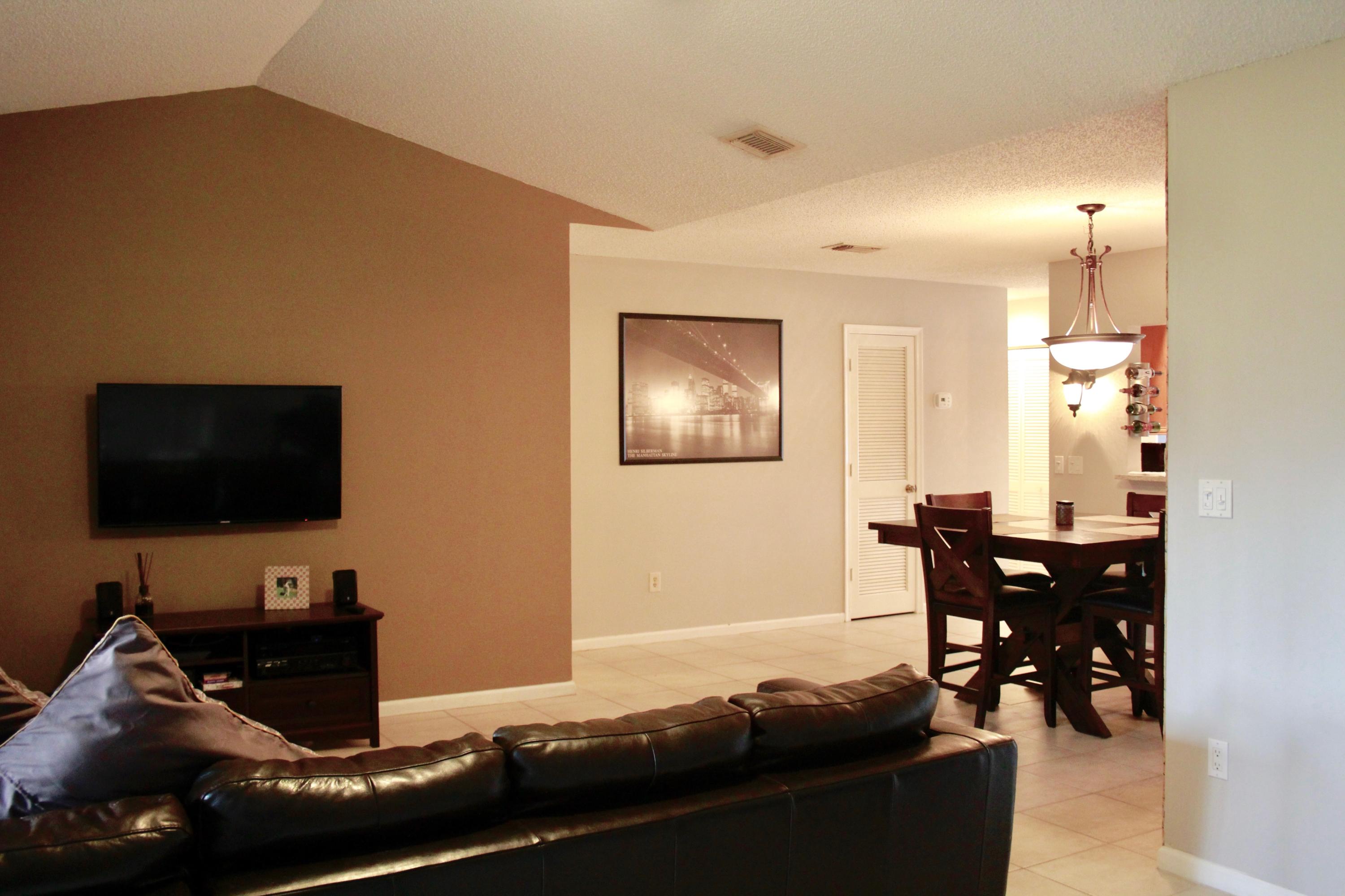 8986 Southwest 19th Street, Unit B Boca Raton, FL 33433 - Photo 21 of 55 a living room with furniture and a flat screen tv