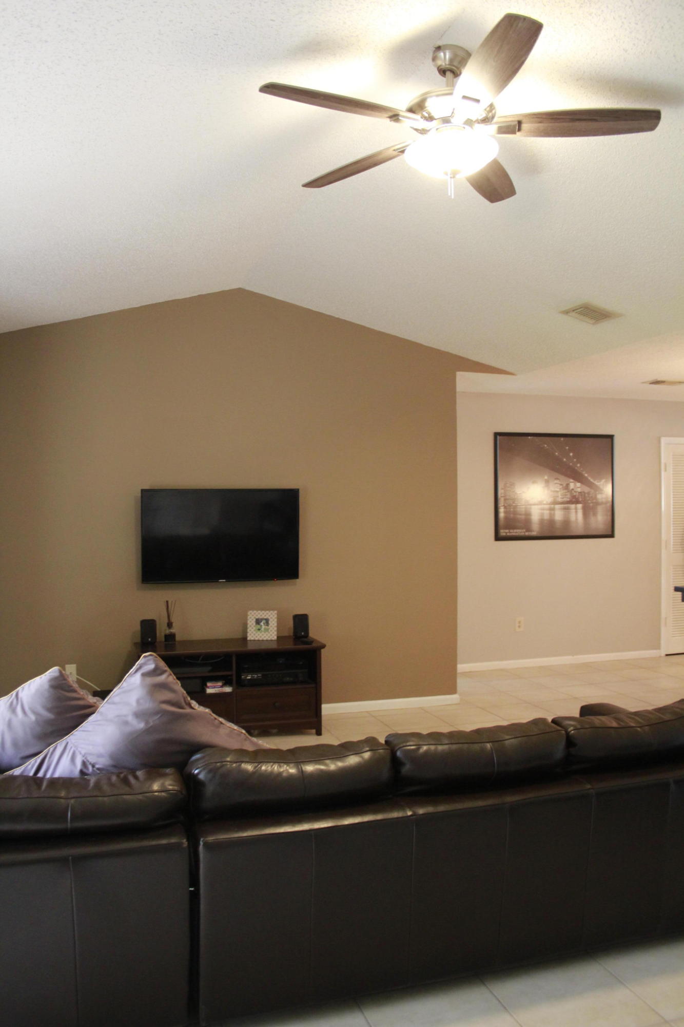 8986 Southwest 19th Street, Unit B Boca Raton, FL 33433 - Photo 22 of 55 a living room with furniture and a flat screen tv