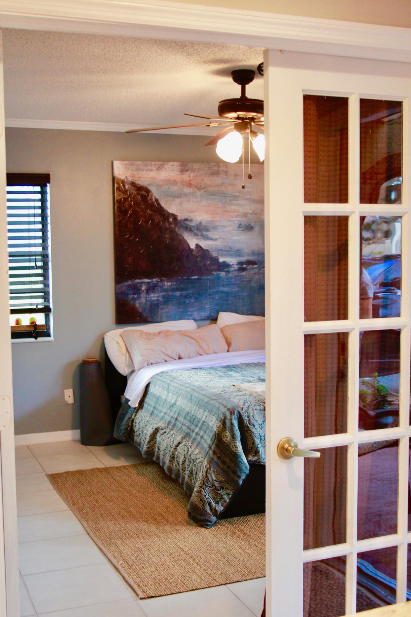 8986 Southwest 19th Street, Unit B Boca Raton, FL 33433 - Photo 33 of 55 a bedroom with a bed and window