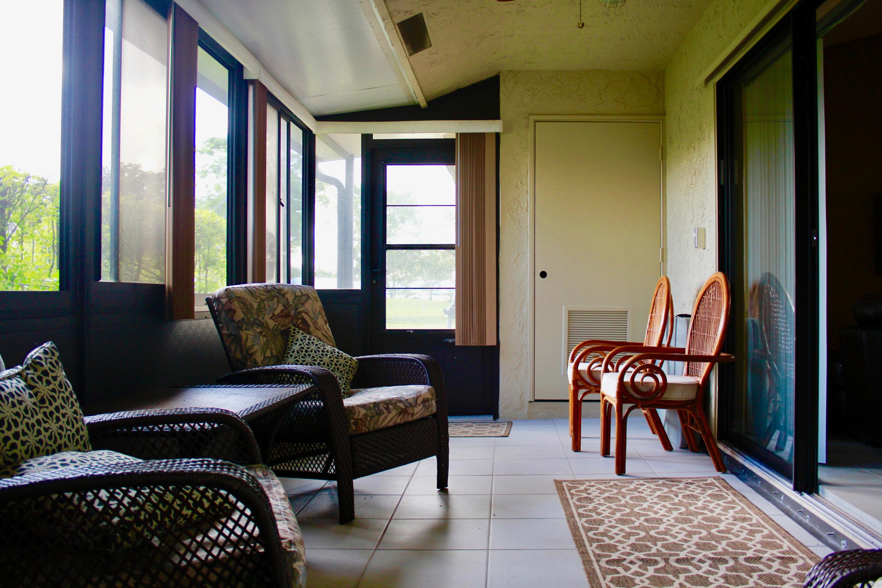 8986 Southwest 19th Street, Unit B Boca Raton, FL 33433 - Photo 40 of 55 a living room with furniture and a window