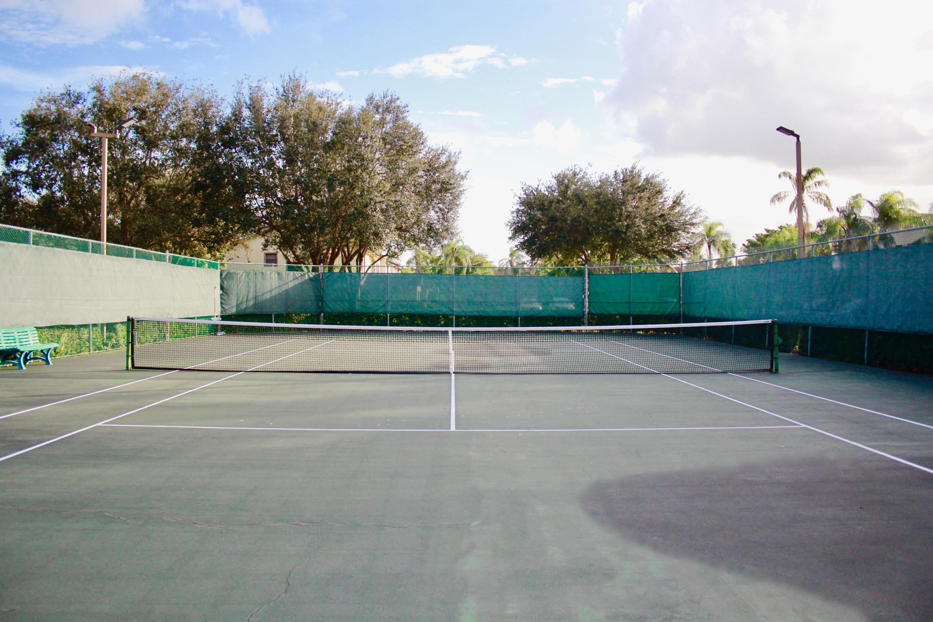 8986 Southwest 19th Street, Unit B Boca Raton, FL 33433 - Photo 55 of 55 a view of a tennis court