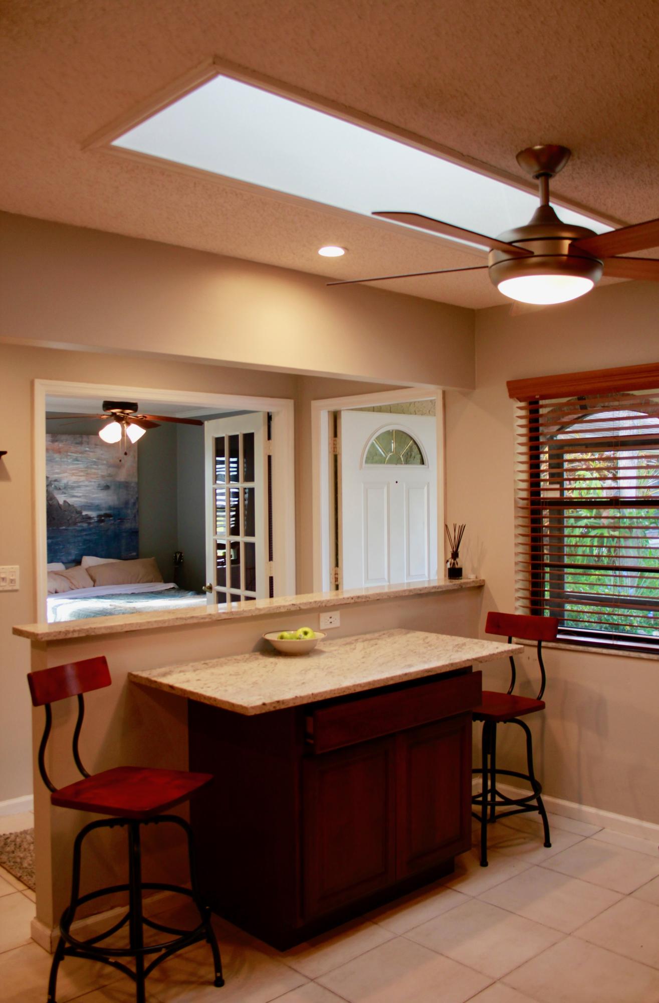 8986 Southwest 19th Street, Unit B Boca Raton, FL 33433 - Photo 6 of 55 a dining room with a table and chairs
