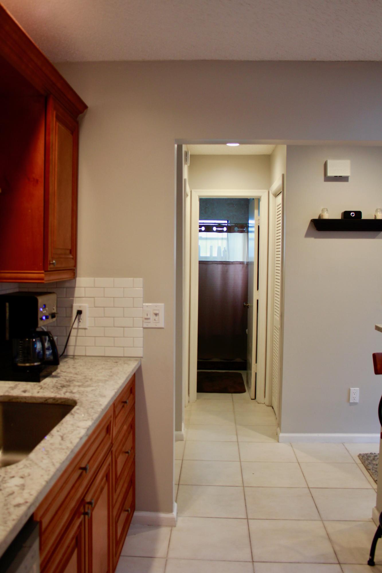 8986 Southwest 19th Street, Unit B Boca Raton, FL 33433 - Photo 8 of 55 a kitchen with a refrigerator and a sink