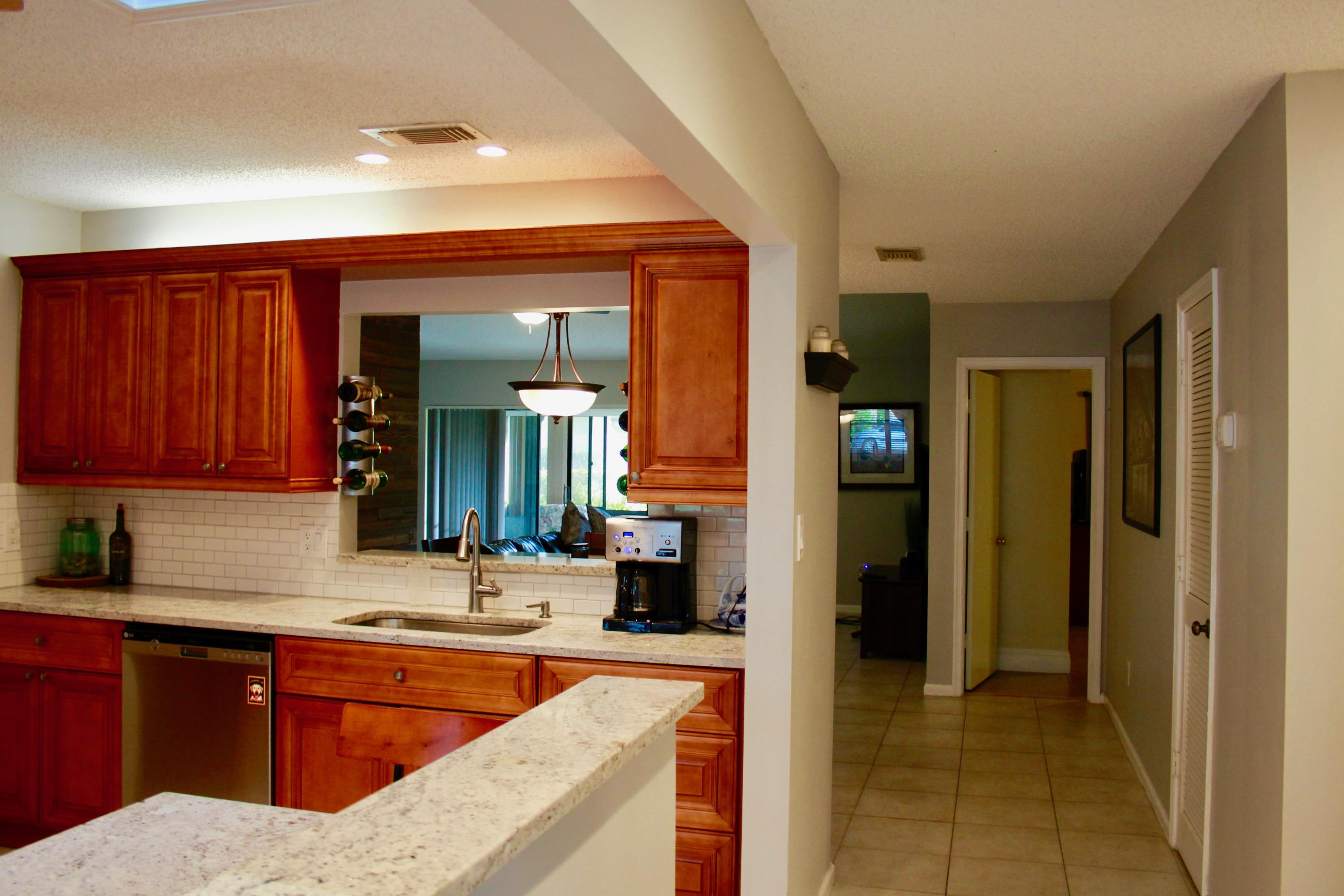 8986 Southwest 19th Street, Unit B Boca Raton, FL 33433 - Photo 10 of 55 a large bathroom with a sink and a large mirror