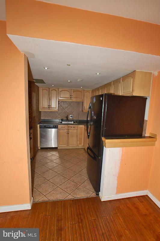 8622 Manchester Road, Unit 3 Silver Spring, MD 20901 - Photo 14 of 23 a view of a kitchen with wooden floor and electronic appliances