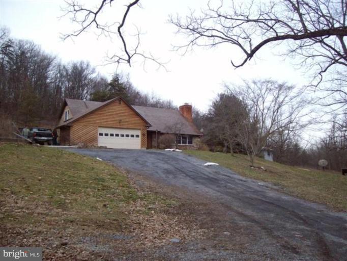 514 Redland Road Cross Junction, VA 22625 - Photo 1 of 24 a view of a house with a yard and garage