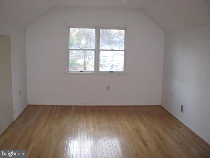 514 Redland Road Cross Junction, VA 22625 - Photo 22 of 24 an empty room with wooden floor and windows