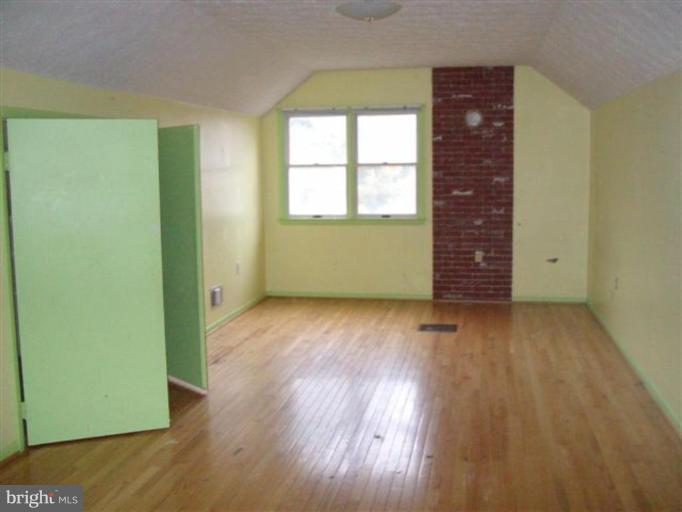 514 Redland Road Cross Junction, VA 22625 - Photo 23 of 24 an empty room with wooden floor and windows