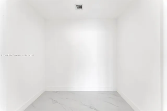 a view of an empty room with window