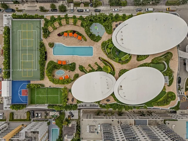 a gym room with gym equipment and a large window
