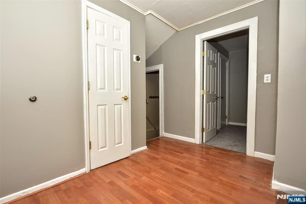 34 Summit Avenue Waldwick, NJ 07463 - Photo 12 of 16 a view of a hallway with wooden floor and closet area