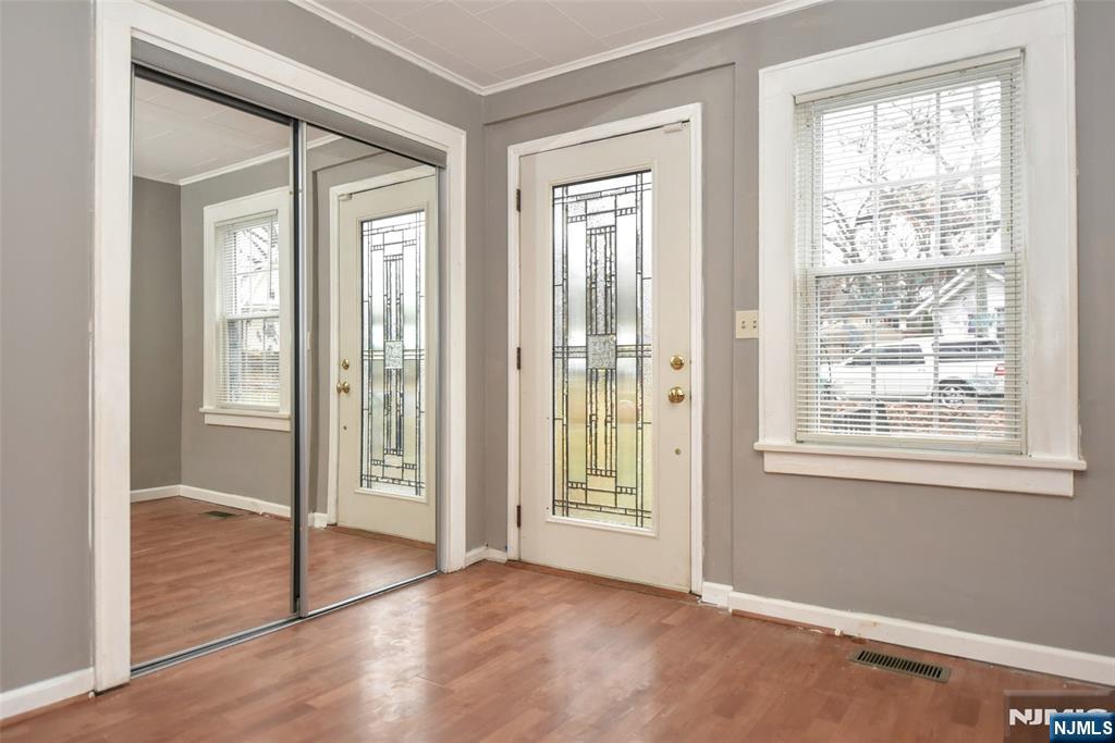 34 Summit Avenue Waldwick, NJ 07463 - Photo 2 of 16 a view of an empty room with wooden floor and a window