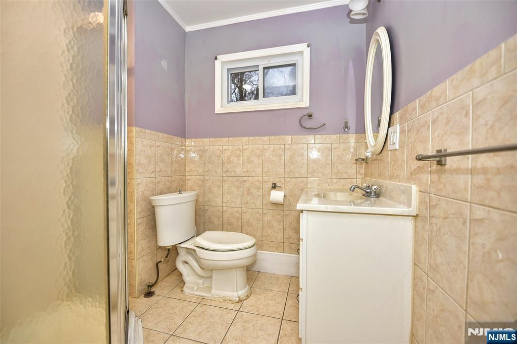 34 Summit Avenue Waldwick, NJ 07463 - Photo 9 of 16 a bathroom with a sink toilet and mirror