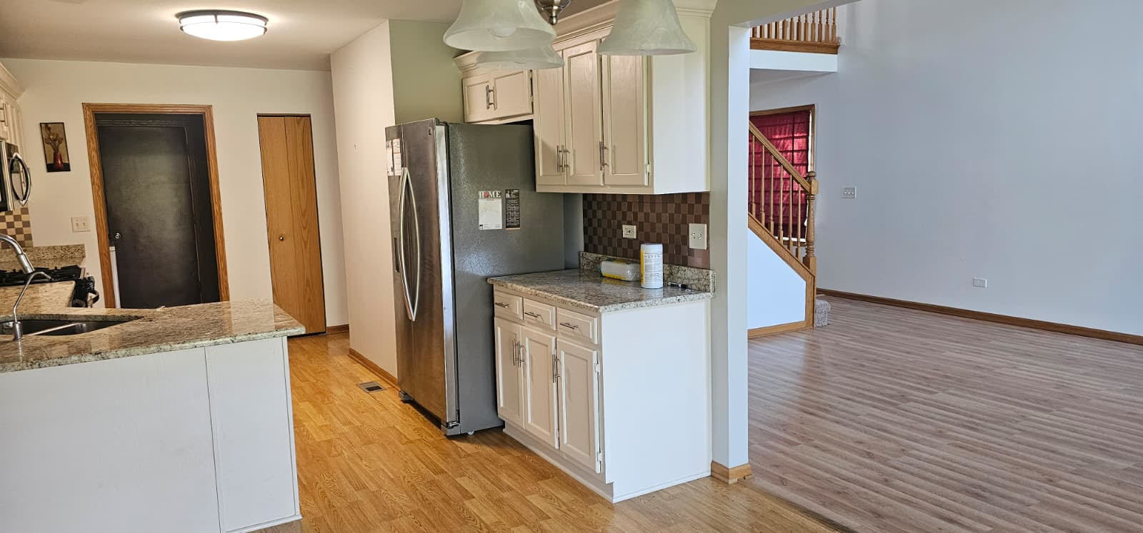 26358 South Evergreen Lane Channahon, IL 60410 - Photo 15 of 28 a kitchen with a refrigerator sink and cabinets