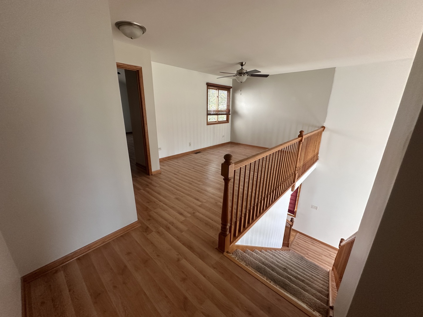 26358 South Evergreen Lane Channahon, IL 60410 - Photo 24 of 28 a view of a hallway with wooden floor and stairs