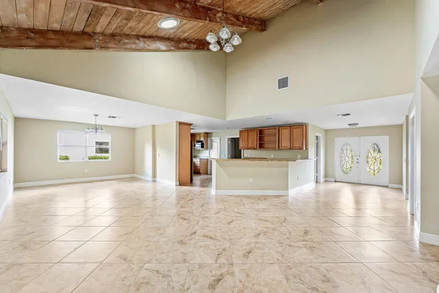 a view of a hallway with a kitchen