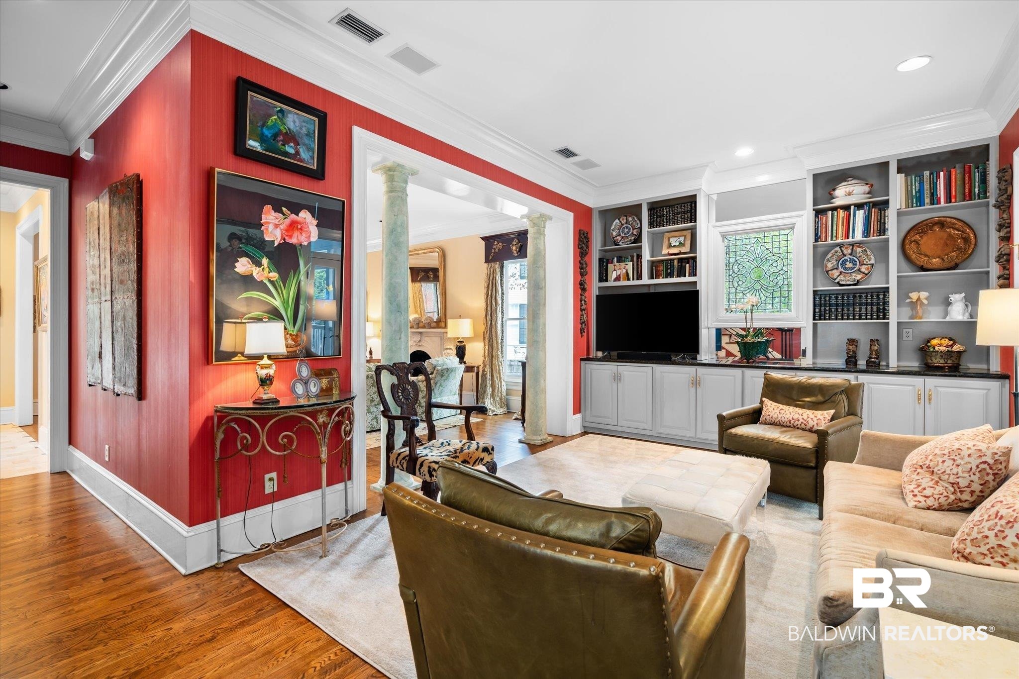 354 Dogwood Lane Mobile, AL 36608 - Photo 8 of 44 Living room featuring ornamental molding, decorative columns, light hardwood / wood-style flooring, and built in features