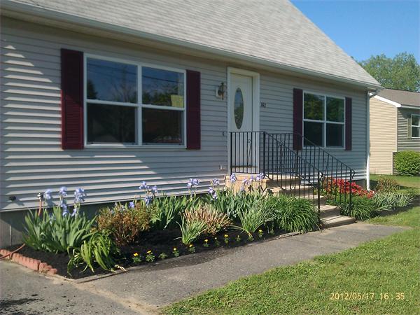 167 Fitch Road Clinton, MA 01510 - Photo 1 of 26 a front view of a house with a garden
