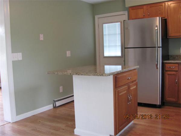 167 Fitch Road Clinton, MA 01510 - Photo 11 of 26 a view of a kitchen with a refrigerator