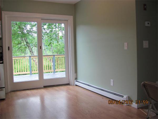 167 Fitch Road Clinton, MA 01510 - Photo 12 of 26 an empty room with wooden floor and windows