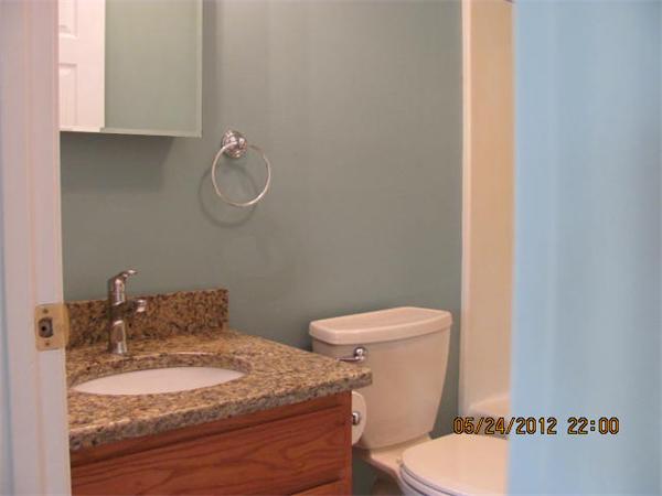 167 Fitch Road Clinton, MA 01510 - Photo 15 of 26 a bathroom with a granite countertop toilet and a sink