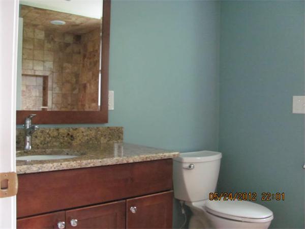 167 Fitch Road Clinton, MA 01510 - Photo 16 of 26 a bathroom with a granite countertop toilet and a sink