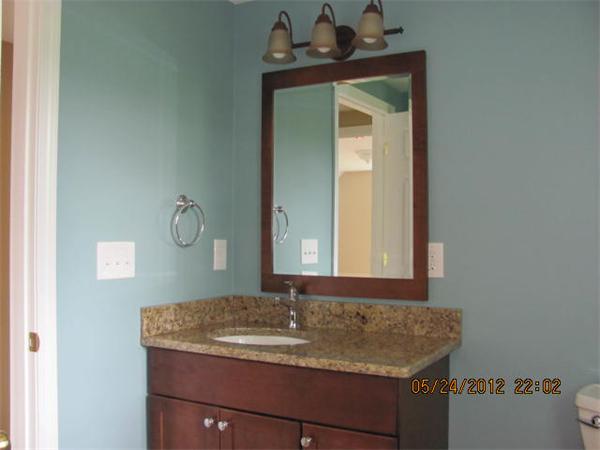 167 Fitch Road Clinton, MA 01510 - Photo 19 of 26 a bathroom with a granite countertop sink and a mirror