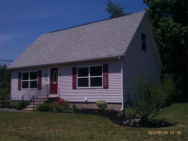 167 Fitch Road Clinton, MA 01510 - Photo 3 of 26 a brick house with a yard potted plants and large tree