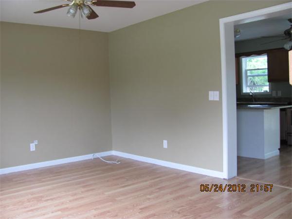 167 Fitch Road Clinton, MA 01510 - Photo 9 of 26 a view of a livingroom with a ceiling fan and wooden floor