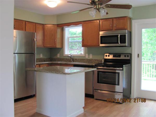 167 Fitch Road Clinton, MA 01510 - Photo 10 of 26 a kitchen with stainless steel appliances a stove a sink and a microwave
