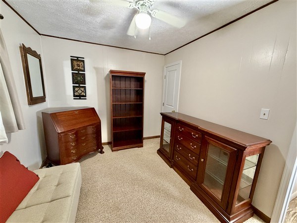 238 Trails End Road Blue Ridge, GA 30513 - Photo 19 of 32 a bedroom with a bed and a television