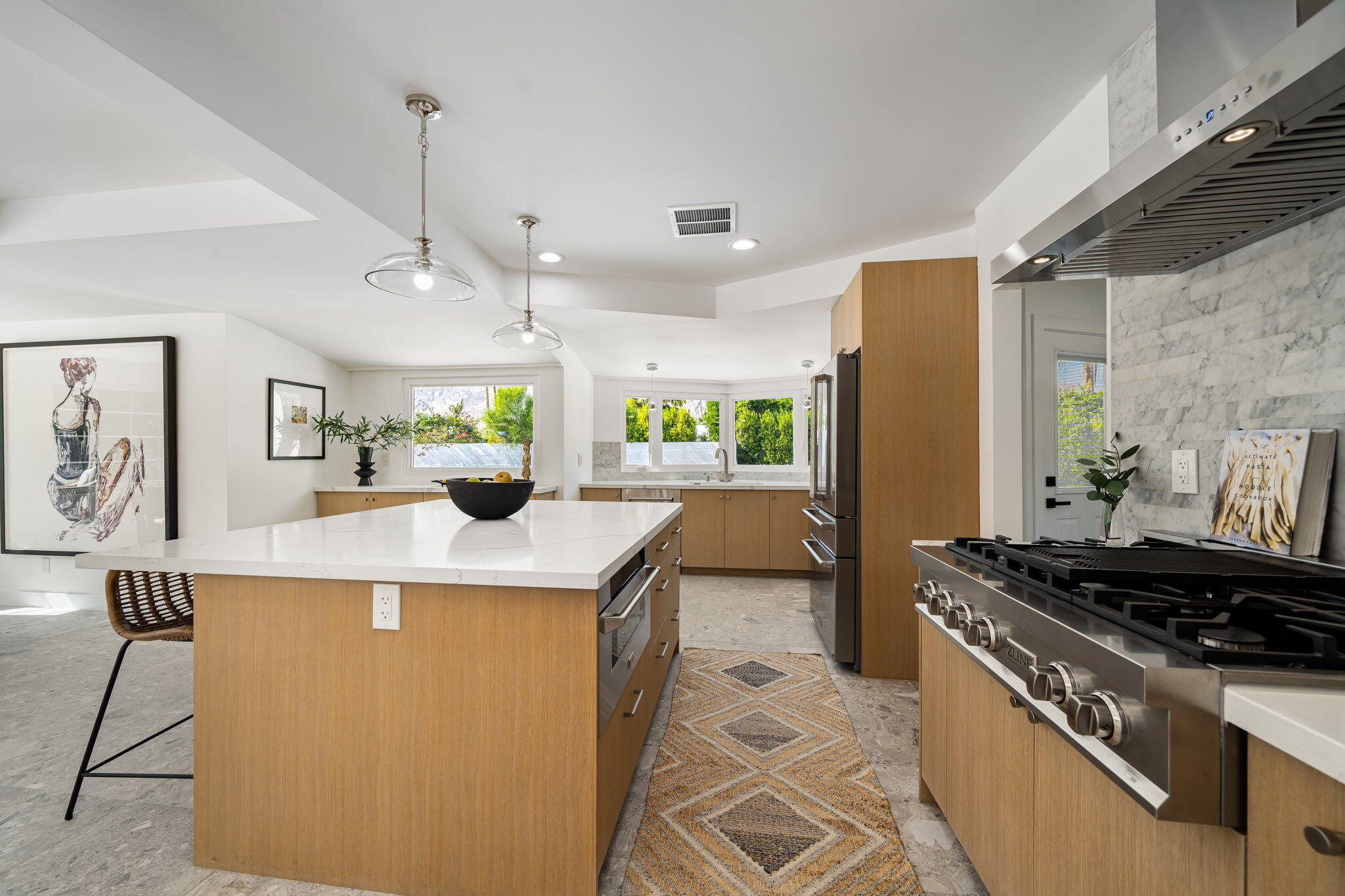 1037 Tamarisk Road Palm Springs, CA 92262 - Photo 13 of 31 a kitchen with stainless steel appliances granite countertop a sink stove and refrigerator