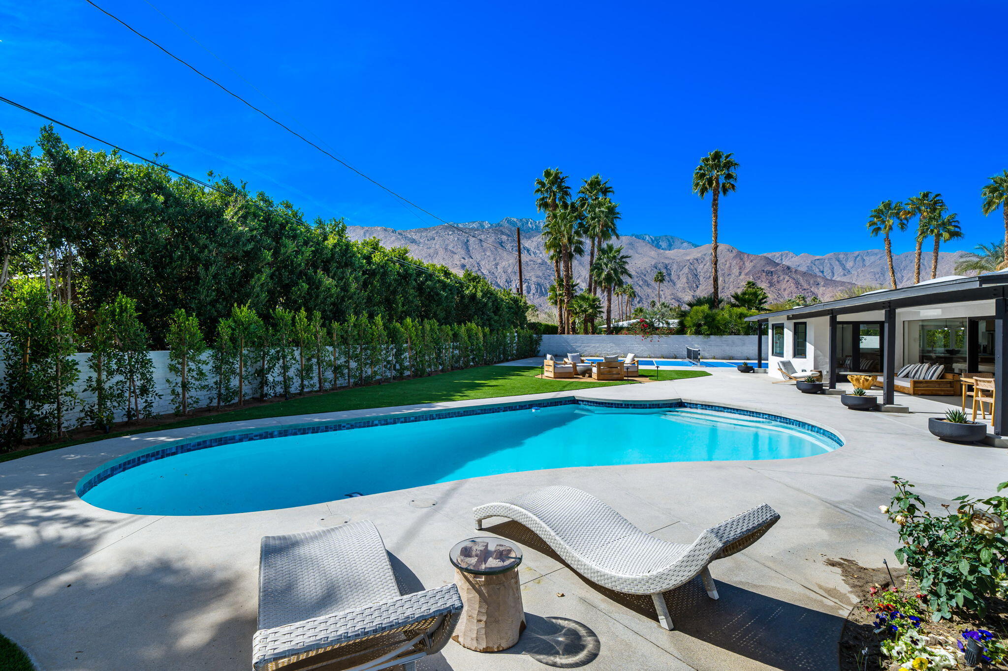 1037 Tamarisk Road Palm Springs, CA 92262 - Photo 29 of 31 a view of outdoor space and swimming pool