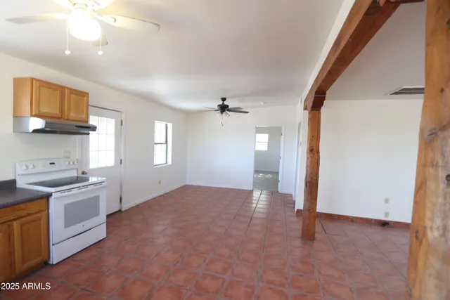 a view of a kitchen with a sink and a stove top oven
