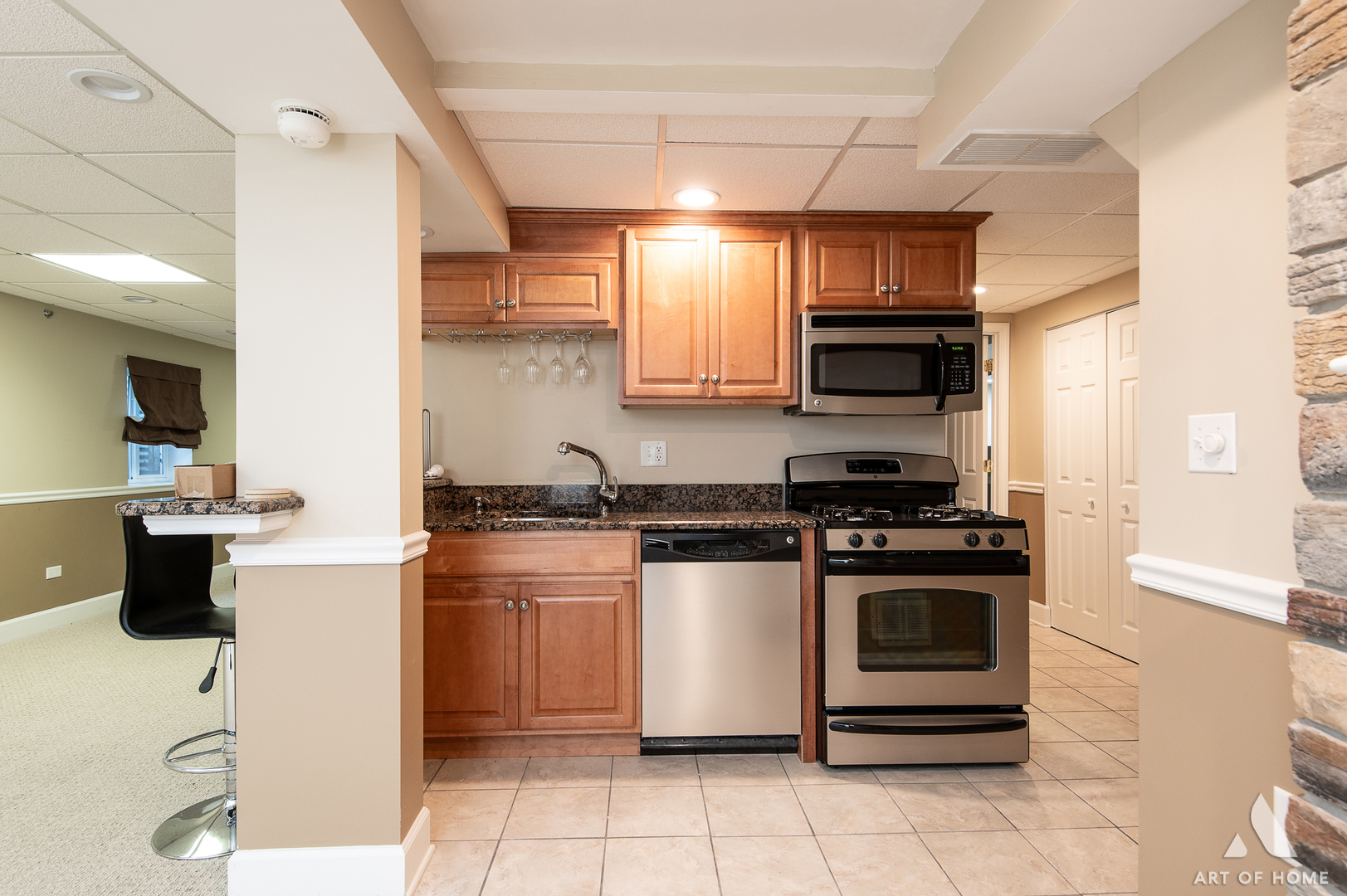 10646 Golf Road Orland Park, IL 60462 - Photo 44 of 55 a kitchen with stainless steel appliances granite countertop a stove a sink and a microwave
