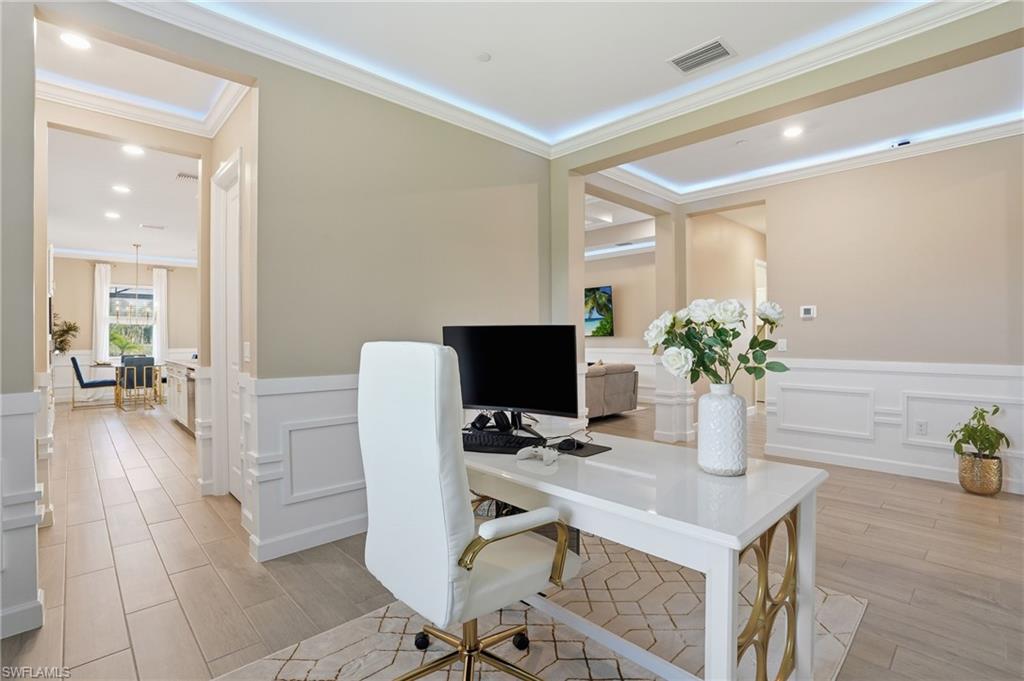 17120 Serengeti Circle Alva, FL 33920 - Photo 20 of 50 a view of a workspace with furniture and wooden floor