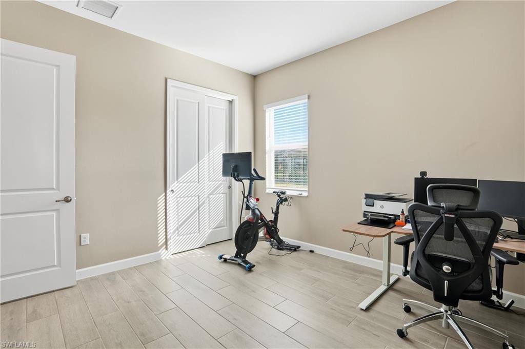 17120 Serengeti Circle Alva, FL 33920 - Photo 22 of 50 a view of a workspace with furniture and a window