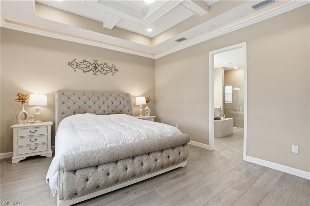 17120 Serengeti Circle Alva, FL 33920 - Photo 24 of 50 a bedroom with a bed and a cabinets