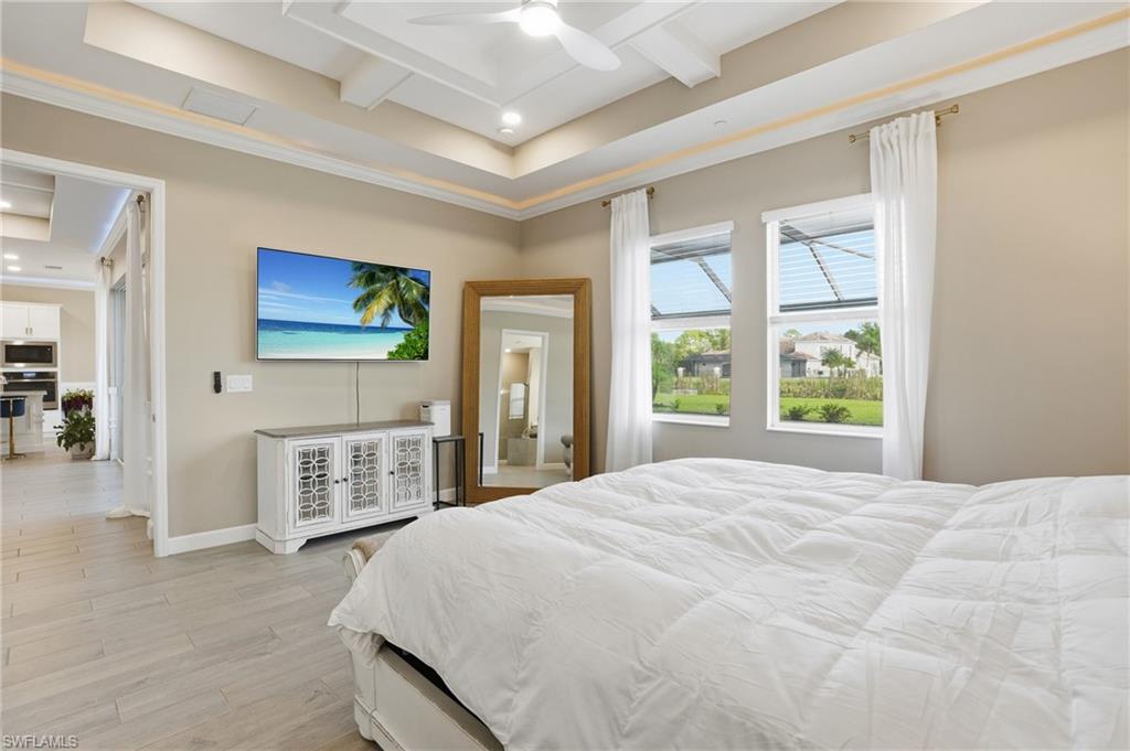 17120 Serengeti Circle Alva, FL 33920 - Photo 26 of 50 a spacious bedroom with a large bed and a window