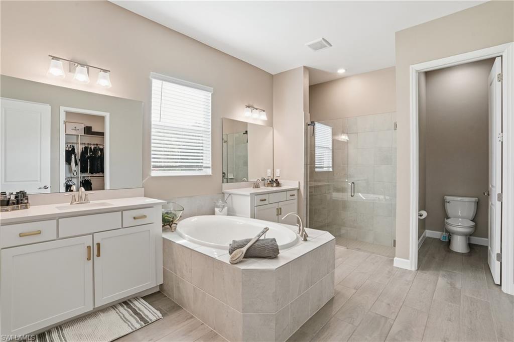 17120 Serengeti Circle Alva, FL 33920 - Photo 27 of 50 a bathroom with a bathtub shower sink and toilet