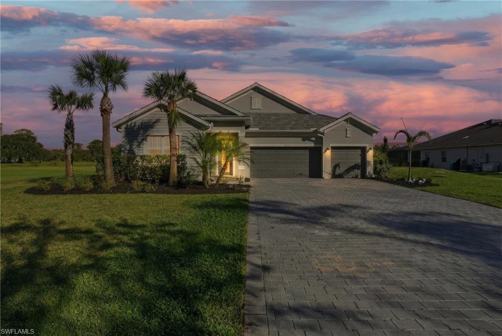 17120 Serengeti Circle Alva, FL 33920 - Photo 3 of 50 a front view of a house with a yard