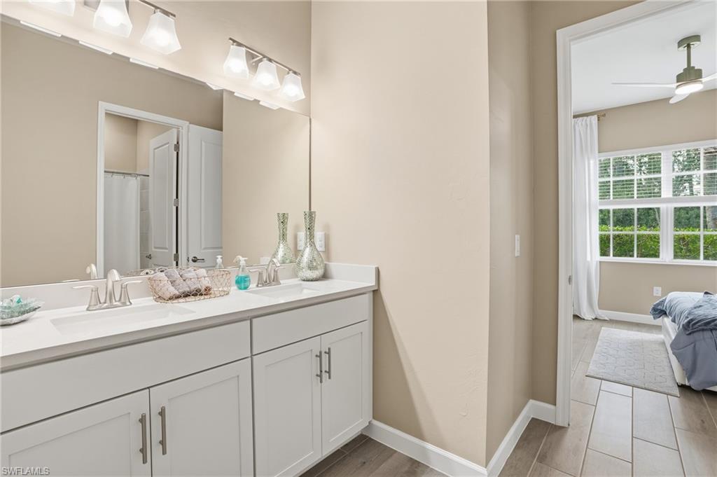 17120 Serengeti Circle Alva, FL 33920 - Photo 33 of 50 a bathroom with a sink and a mirror