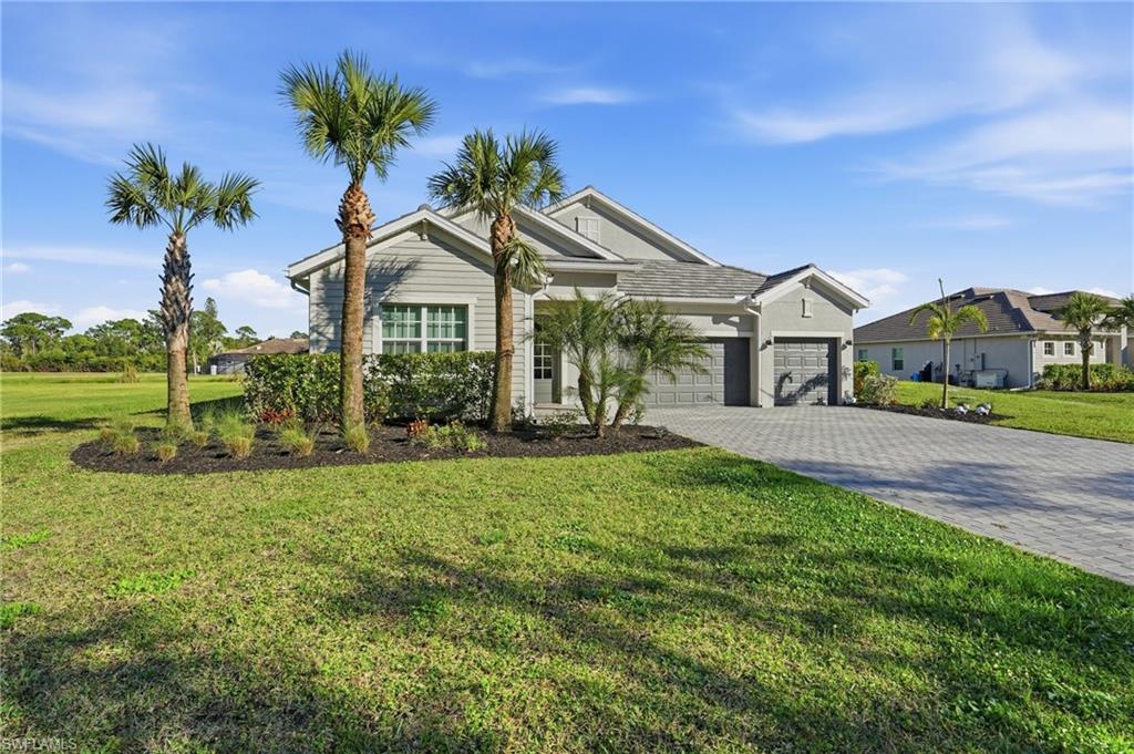 17120 Serengeti Circle Alva, FL 33920 - Photo 6 of 50 a front view of a house with a garden
