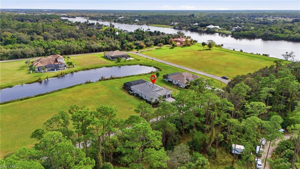 17120 Serengeti Circle Alva, FL 33920 - Photo 7 of 50 an aerial view of a houses with a lake view