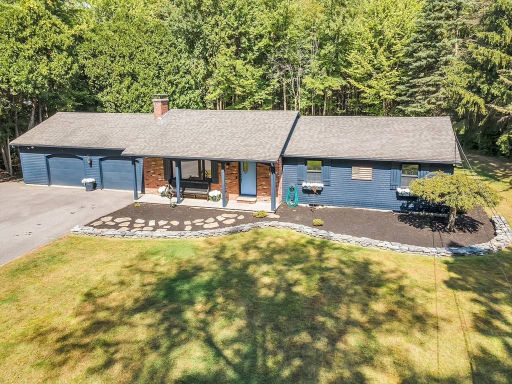 707 Sterling Road Lancaster, MA 01523 - Photo 1 of 40 a front view of a house with swimming pool