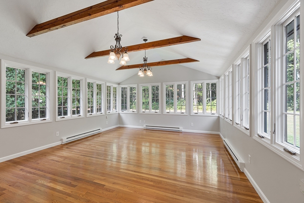 707 Sterling Road Lancaster, MA 01523 - Photo 13 of 40 a view of empty room with wooden floor and fan