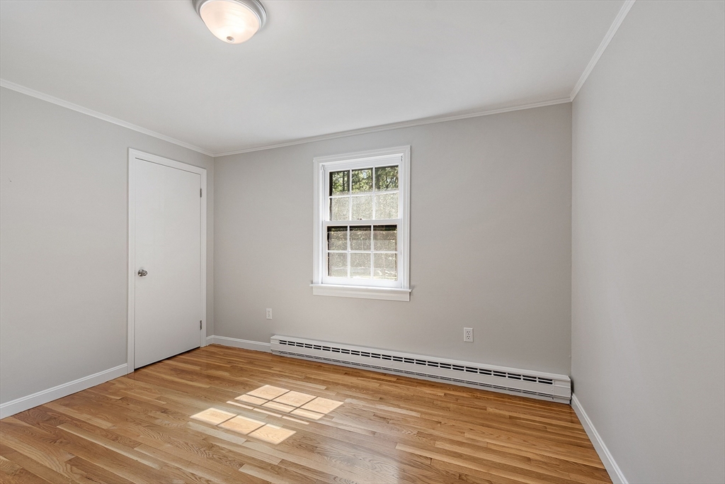 707 Sterling Road Lancaster, MA 01523 - Photo 22 of 40 a view of a room with wooden floor and cabinet