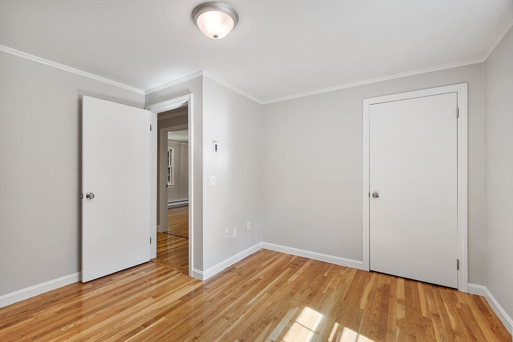 707 Sterling Road Lancaster, MA 01523 - Photo 23 of 40 a view of empty room with wooden floor