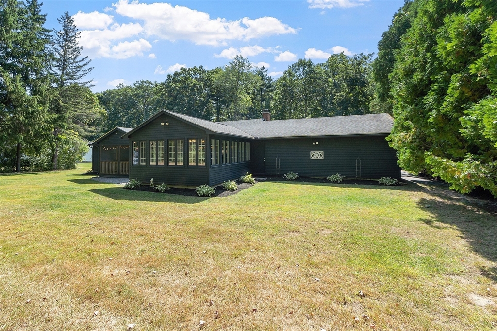 707 Sterling Road Lancaster, MA 01523 - Photo 28 of 40 a front view of a house with a yard